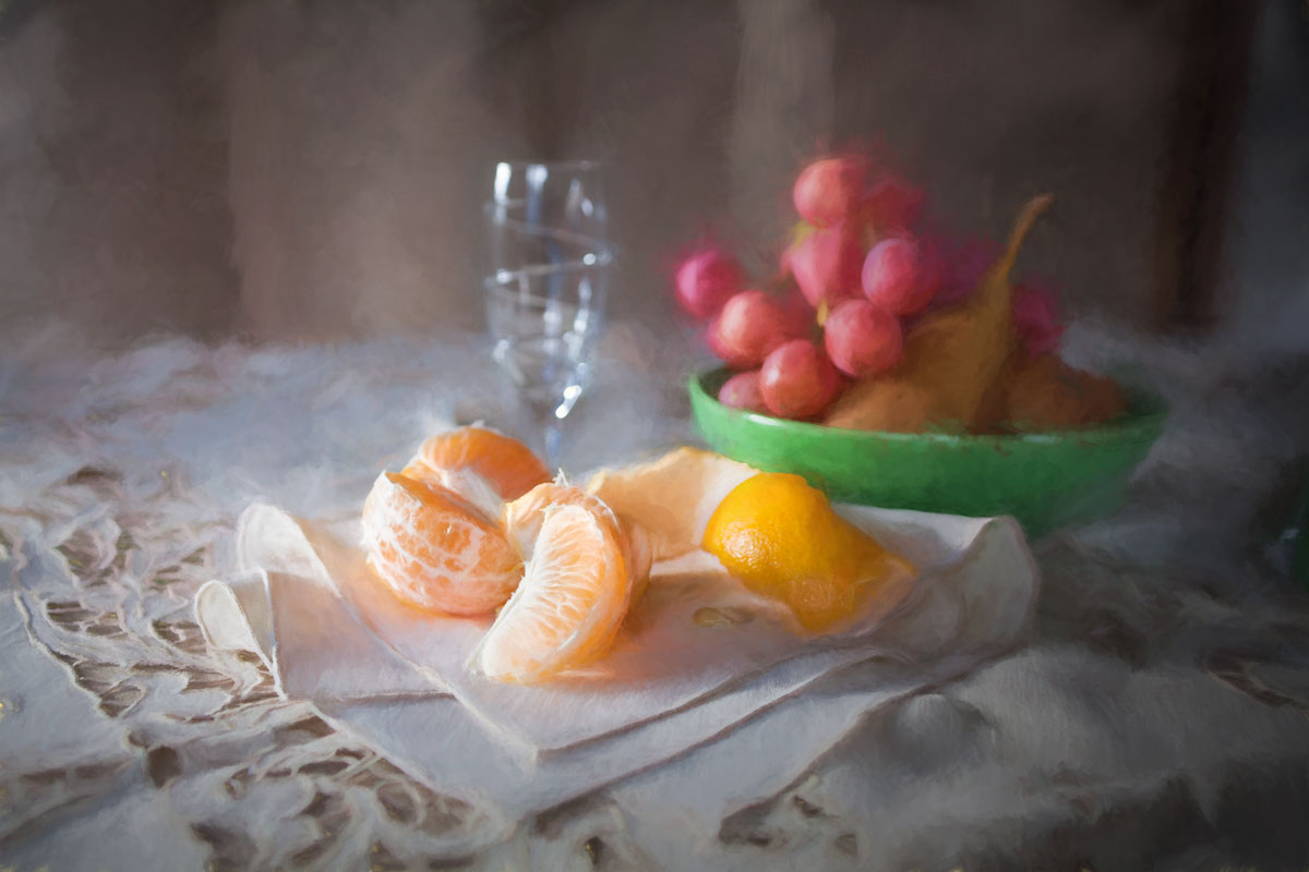 tangerines and grapes on linen tablecloth